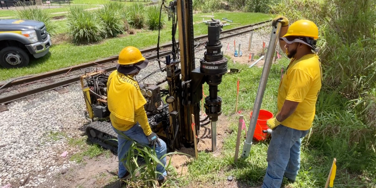 Helicon crew members completing the underpinning process with helical piers at Busch Gardens in Tampa, Florida.