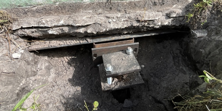 Underpinning under a commercial foundation.