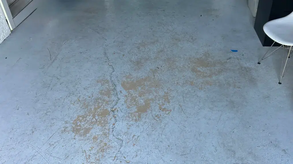 Crack running through residential garage slab caused by settlement movement
